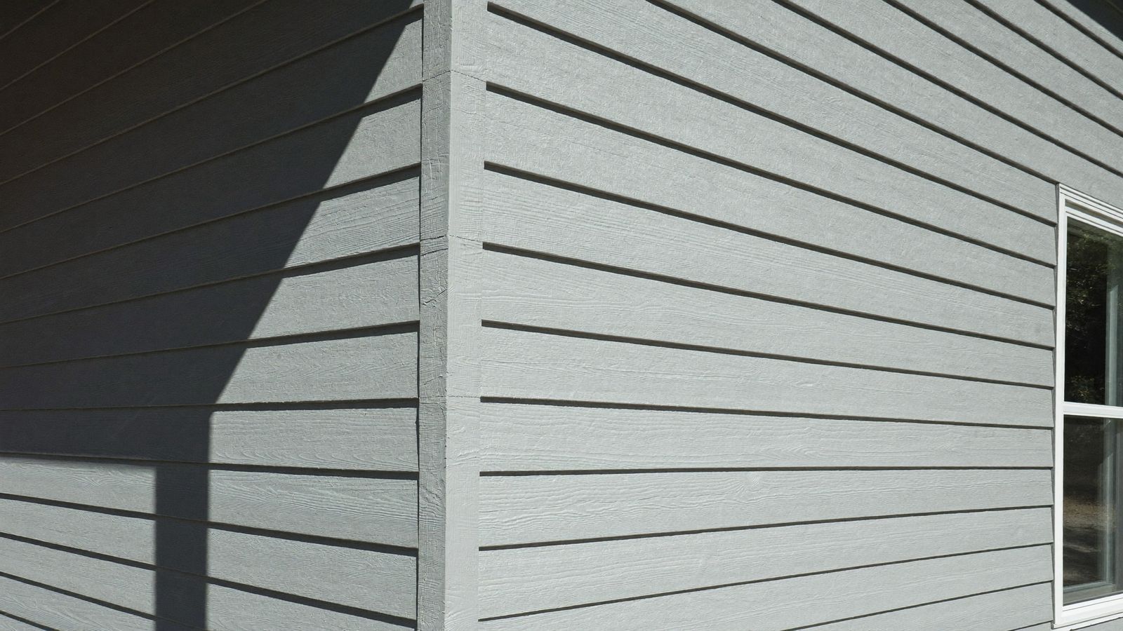 Freshly installed fiber cement lap siding on a Houston home